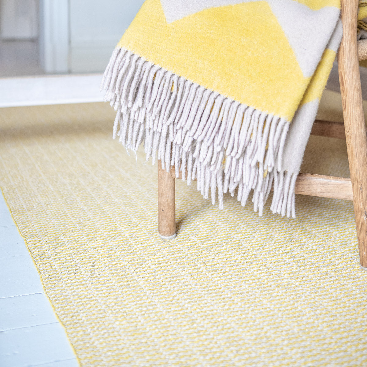 Pemba Woven Plastic Rug by Brita, showing closeup view of pemba woven plastic rug in live shot.