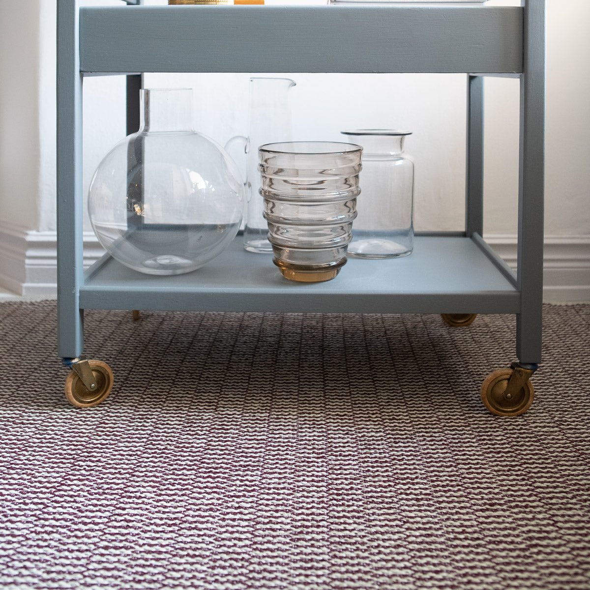 Pemba Woven Plastic Rug by Brita, showing closeup view of pemba woven plastic rug in live shot.