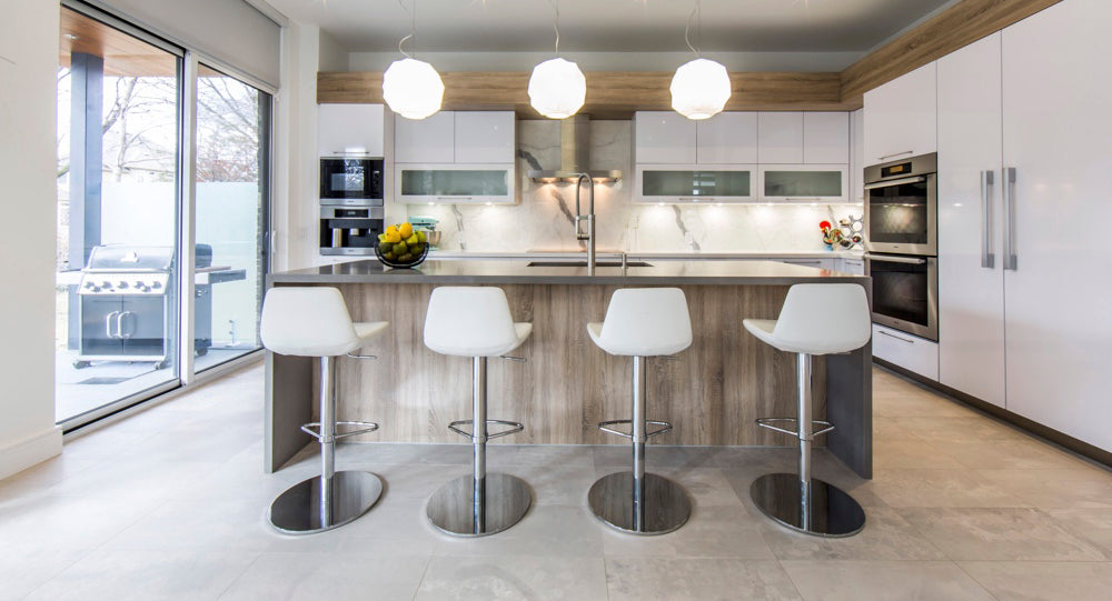 Pera Piston Stool Half Footrest by SohoConcept, showing pitson stools in live shot.