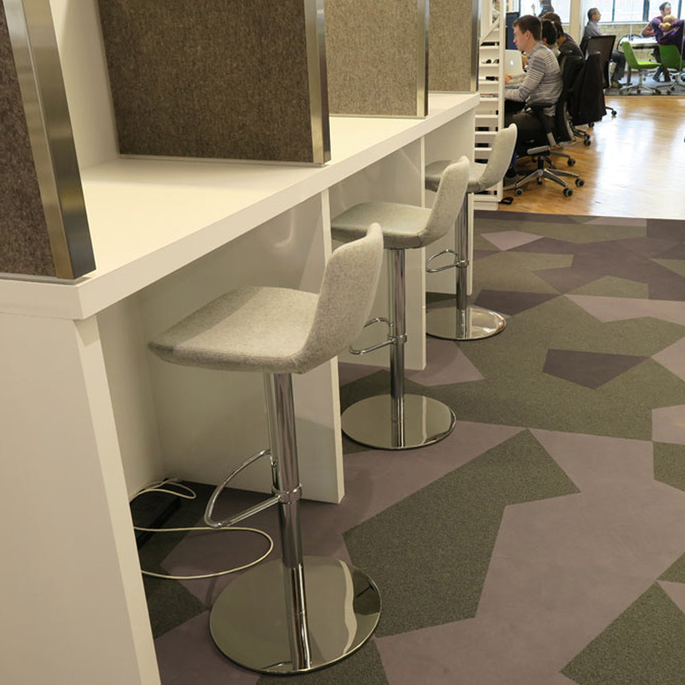 Pera Piston Stool Half Footrest by SohoConcept, showing pitson stools in live shot.