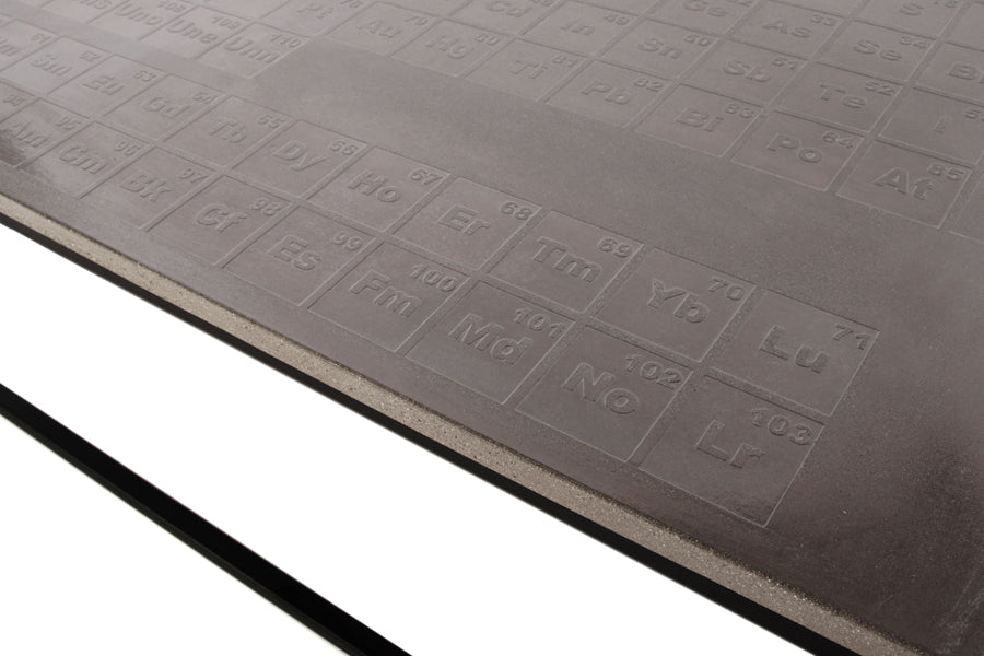 James De Wulf Periodic Coffee Table by De Wulf, showing closeup view of periodic coffee table in light grey concrete.