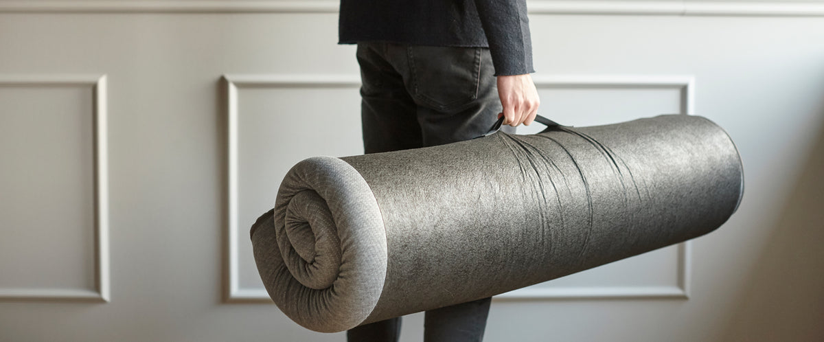 Pillow Topper by Innovation, showing pillow topper with storage bag in live shot.