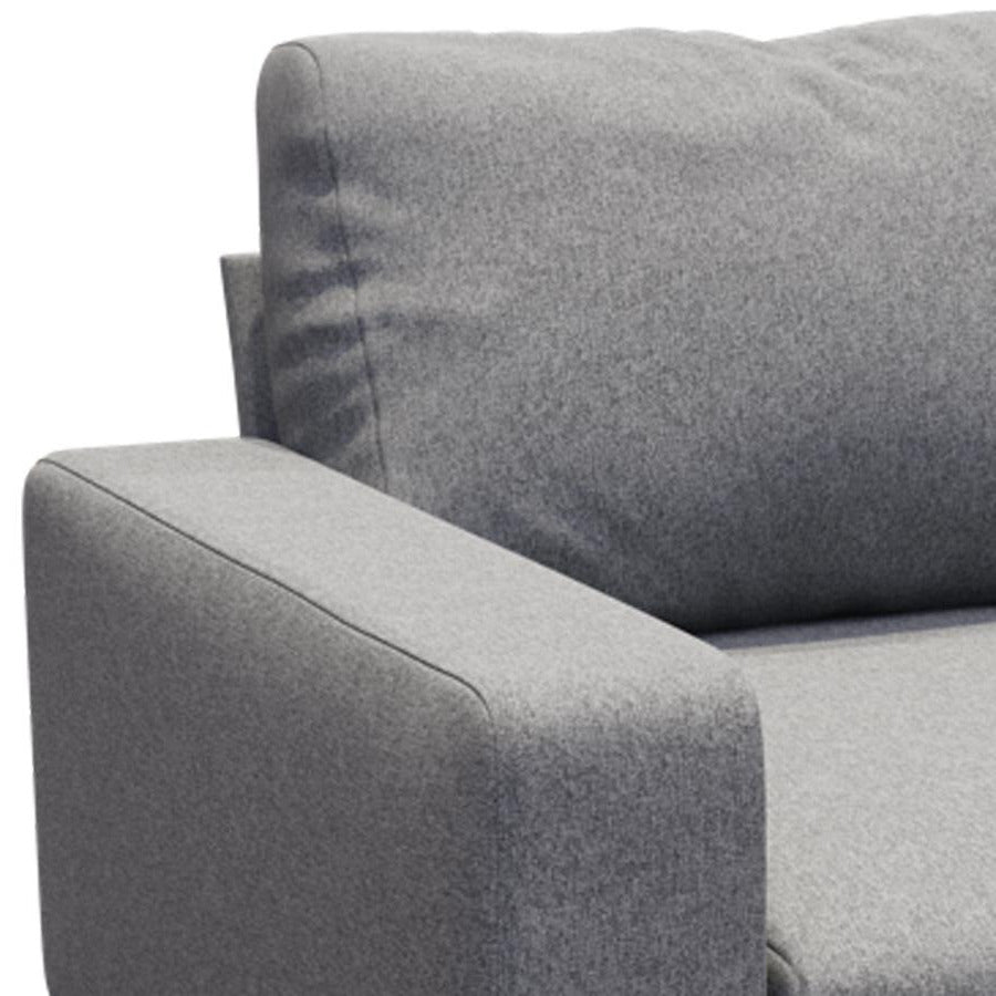 Piu Armchair by B&T, showing closeup view of view of piu armchair in light gray nino fabric.