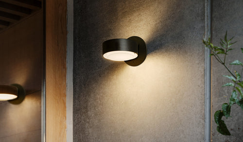 Plaff-On A IP65 Wall Outdoor Light by Marset, showing plaff-on a ip65 wall outdoor lights in live shot.