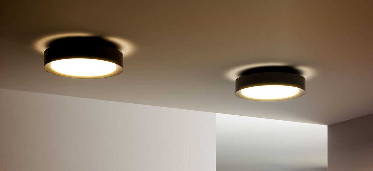 Plaff-On IP54 Wall/Ceiling Lamp by Marset, showing plaff-on ip54 wall/ceiling lamps in live shot.