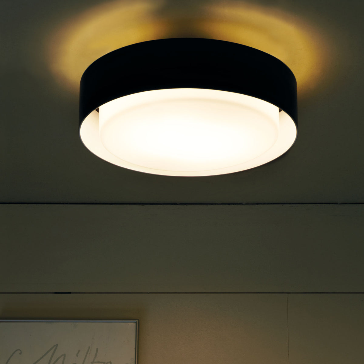 Plaff-On IP54 Wall/Ceiling Lamp by Marset, showing plaff-on ip54 wall/ceiling lamp in live shot.