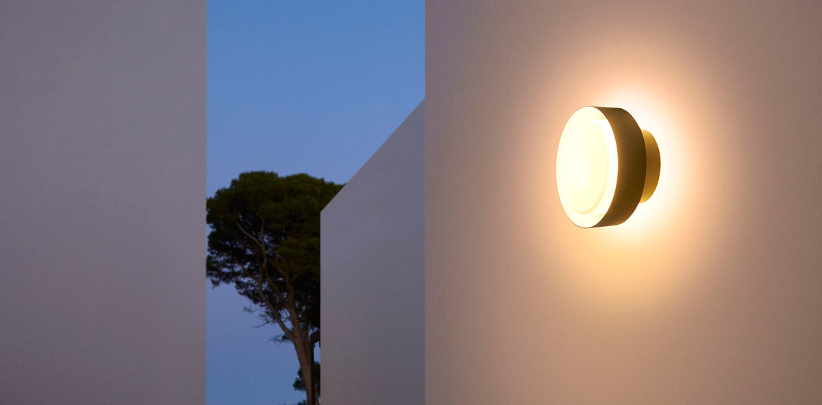 Plaff-On IP65 Outdoor Wall/Ceiling Lamp by Marset, showing plaff-on ip65 outdoor wall/ceiling lamp in live shot.