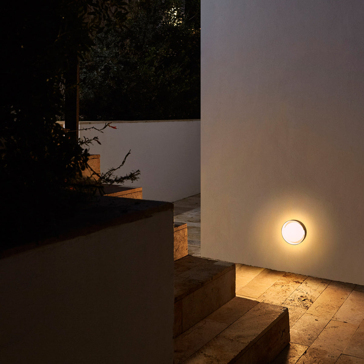 Plaff-On IP65 Outdoor Wall/Ceiling Lamp by Marset, showing plaff-on ip65 outdoor wall/ceiling lamp in live shot.