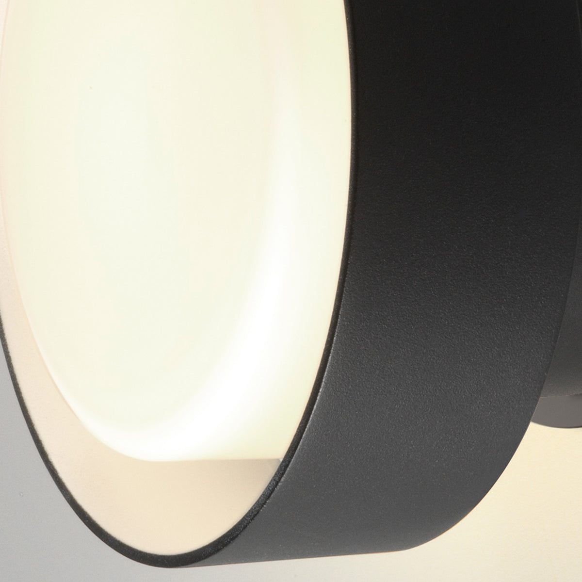 Plaff-On IP65 Outdoor Wall/Ceiling Lamp by Marset, showing closeup view of plaff-on ip65 outdoor wall/ceiling lamp in black painted metal.