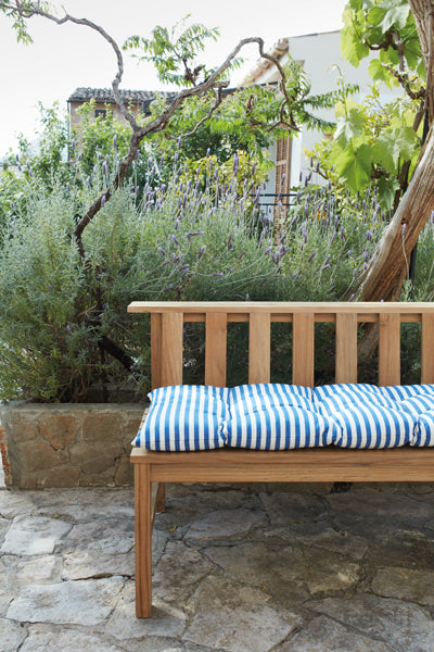 Plank Bench 144 by Skagerak, showing side view of plank bench 144 with cushion in live shot.