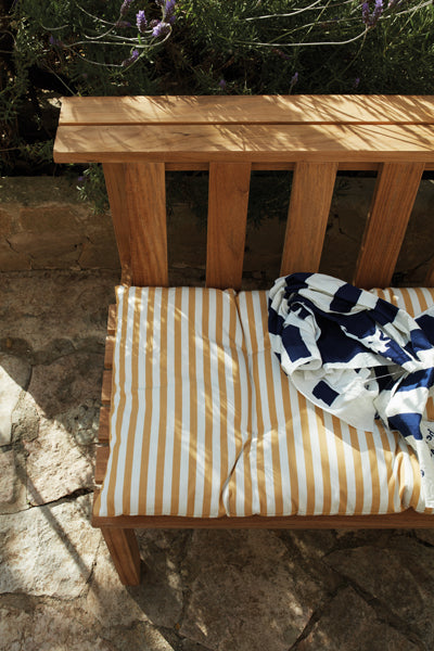 Plank Bench 144 by Skagerak, showing top view of plank bench 144 with cushion in live shot.