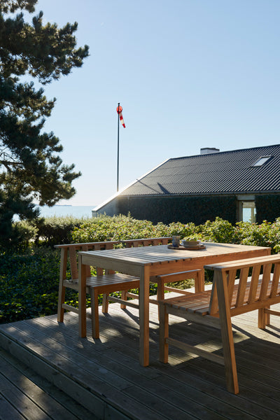 Plank Outdoor Chair by Skagerak, showing plank outdoor chair in live shot.