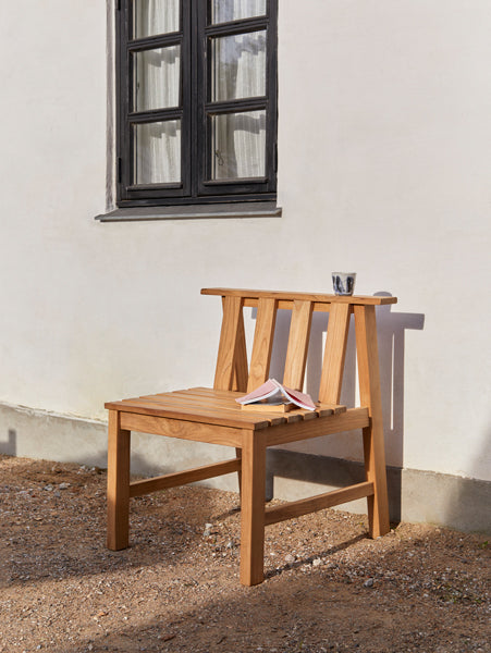Plank Outdoor Chair by Skagerak, showing plank outdoor chair in live shot.