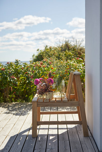 Plank Outdoor Chair by Skagerak, showing plank outdoor chair in live shot.