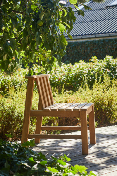 Plank Outdoor Chair by Skagerak, showing plank outdoor chair in live shot.