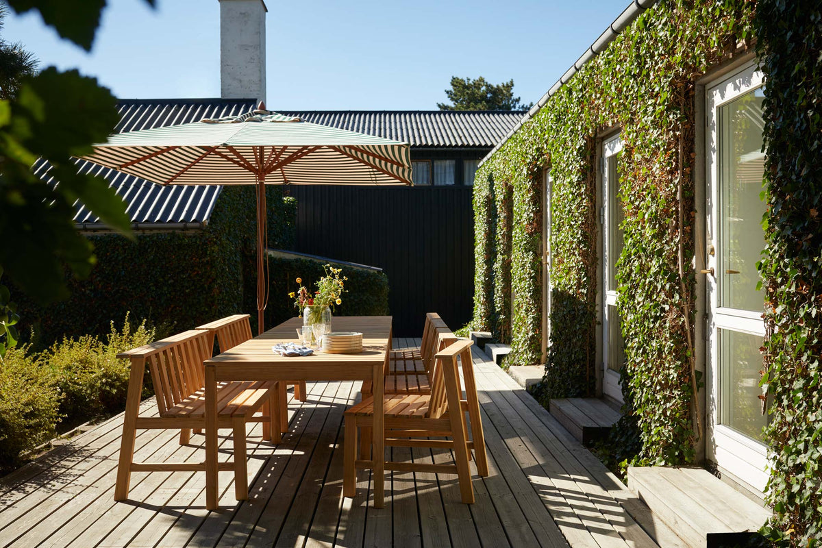 Plank Outdoor Chair by Skagerak, showing plank outdoor chair in live shot.