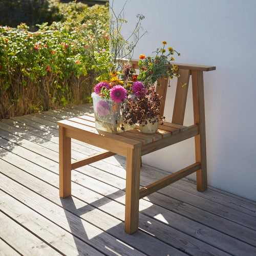 Plank Outdoor Chair by Skagerak, showing plank outdoor chair in live shot.