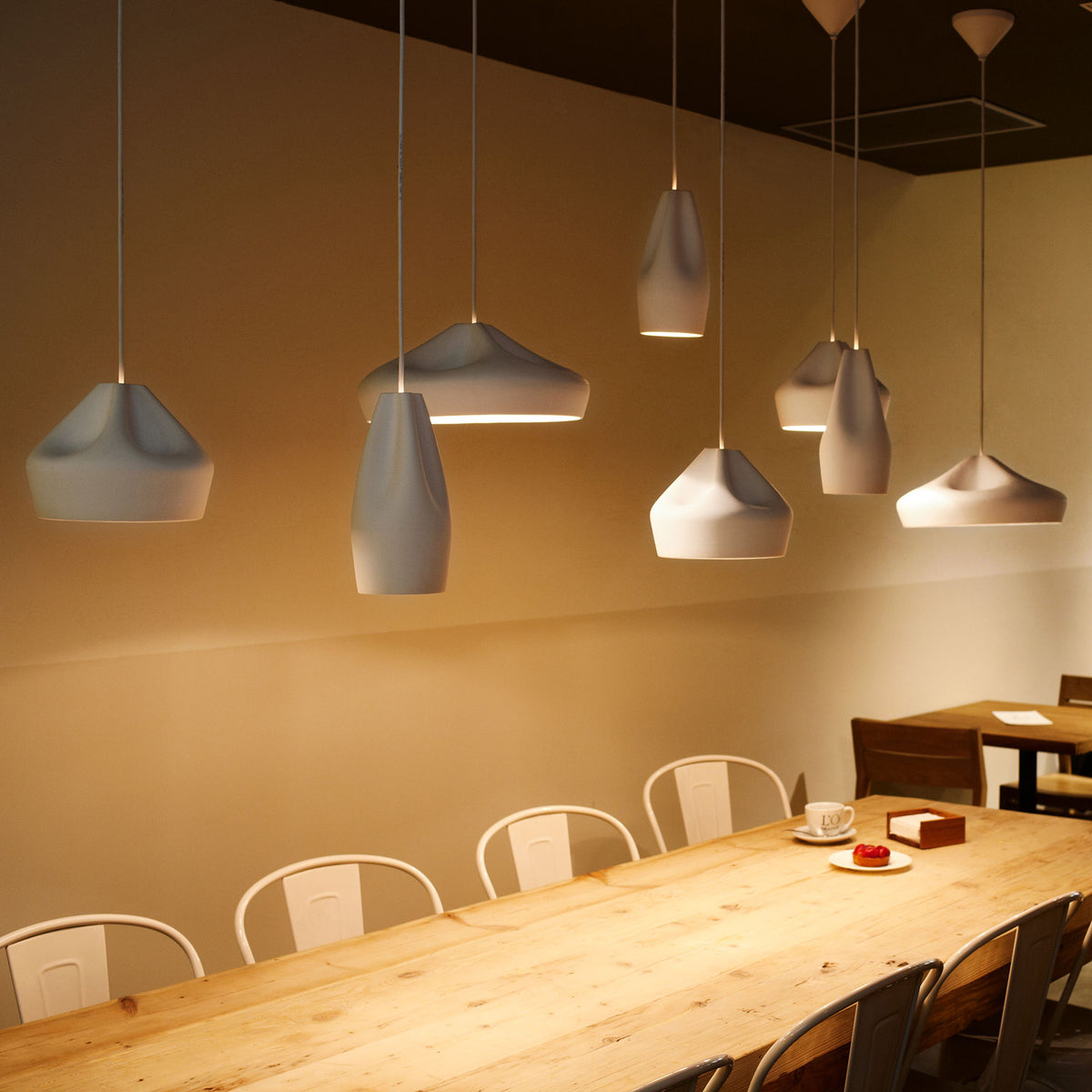 Pleat Box Pendant by Marset, showing pleat box pendants in live shot.