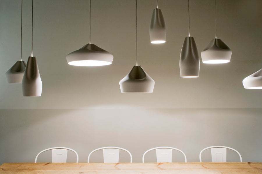 Pleat Box Pendant by Marset, showing pleat box pendants in live shot.