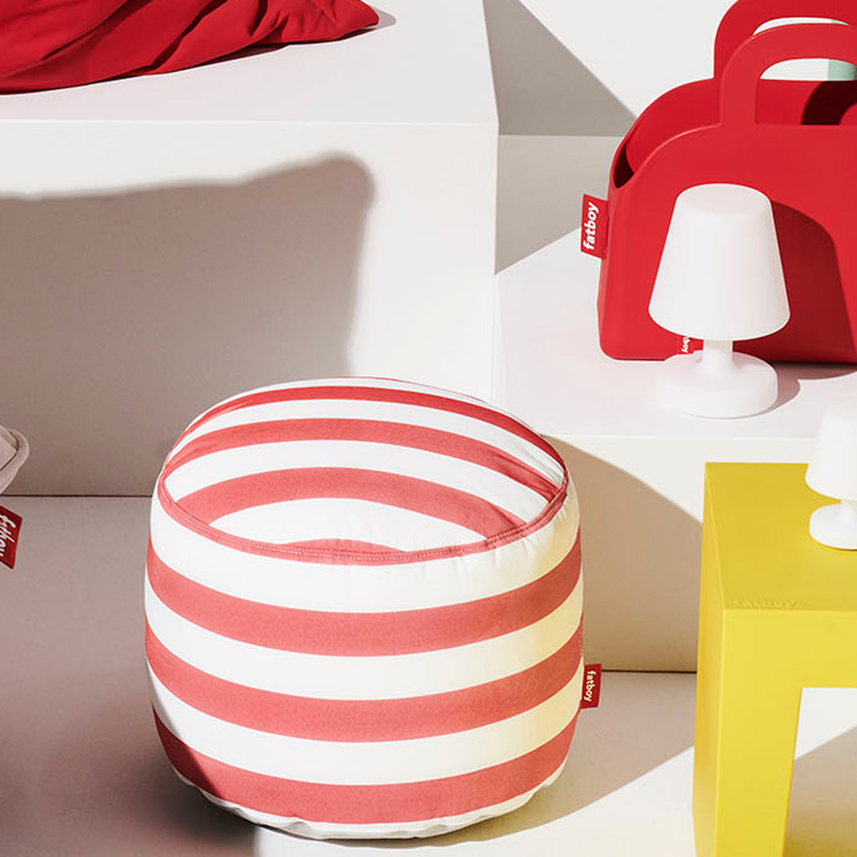 Point Outdoor Pouf/Ottoman by Fatboy, showing point outdoor pouf/ottoman in live shot.