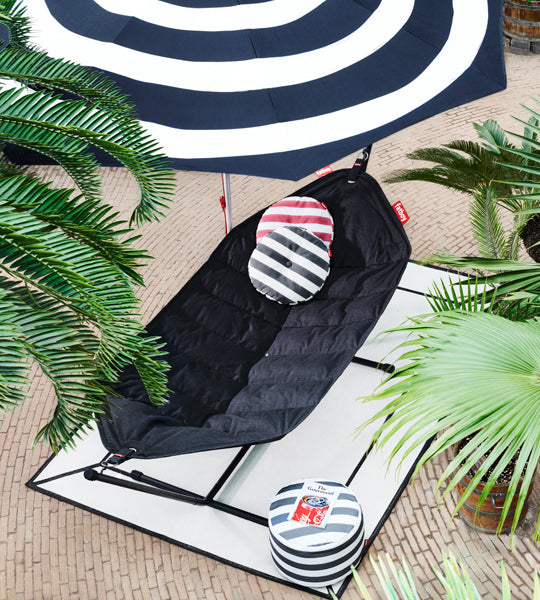 Point Outdoor Pouf/Ottoman by Fatboy, showing point outdoor pouf/ottoman in live shot.