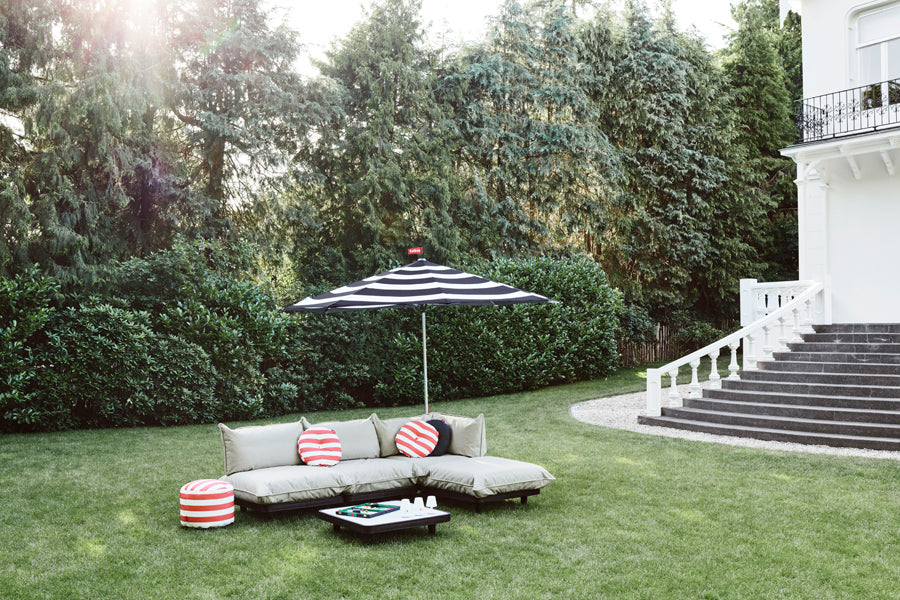 Point Outdoor Pouf/Ottoman by Fatboy, showing point outdoor pouf/ottoman in live shot.