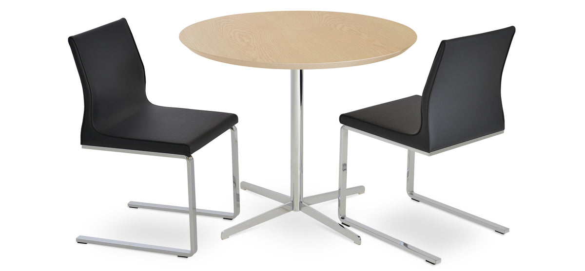 Polo Flat Dining Chair by SohoConcept, showing two flat dining chairs in black ppm (flexible back) with diana dining table/natural ash veneer wood top.