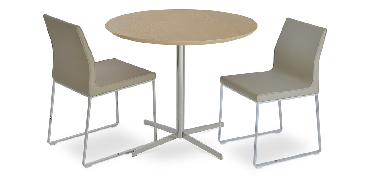 Polo Sled Chair by SohoConcept, showing two sled chairs with table.