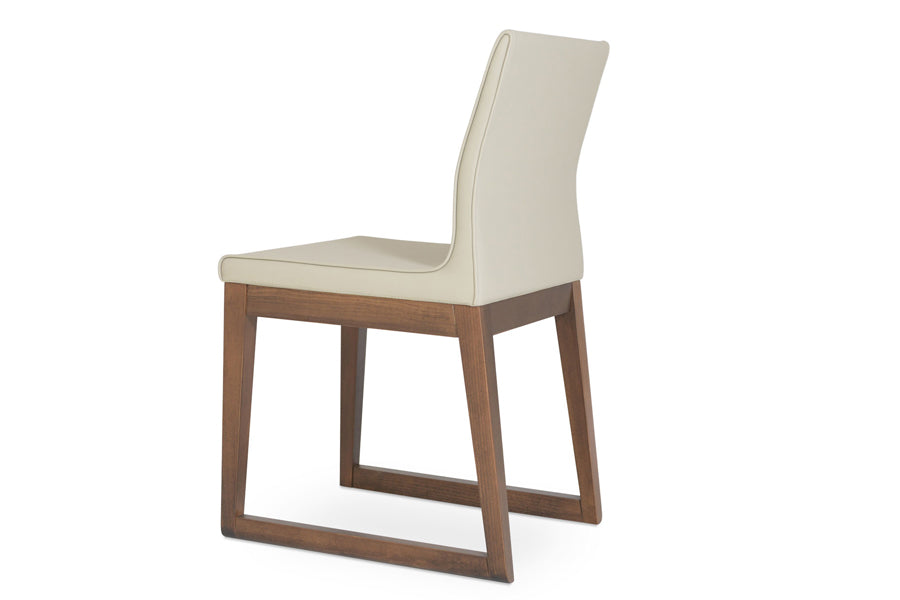 Polo Sled Wood Chair by SohoConcept, showing back angle view of polo sled wood chair in bone ppm with walnut wood base.