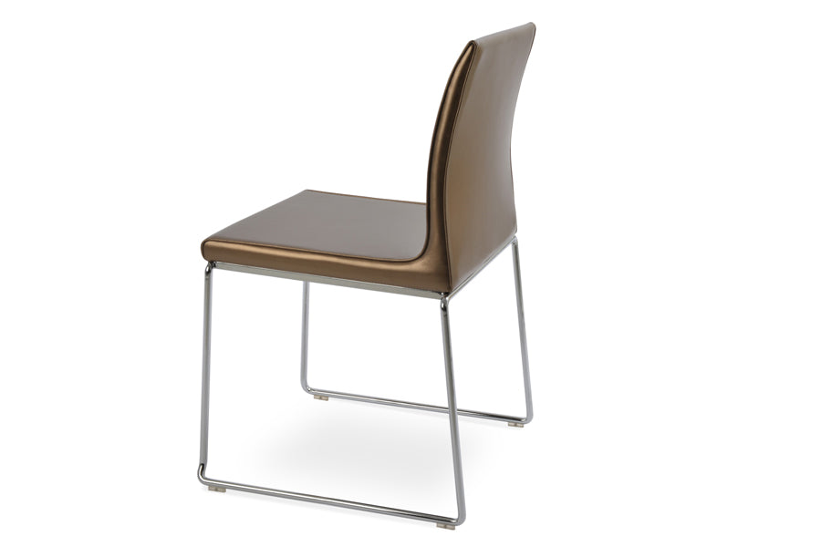 Polo Wire Stackable Chair by SohoConcept, showing angle view in gold ppm (flexible back) with chrome base.