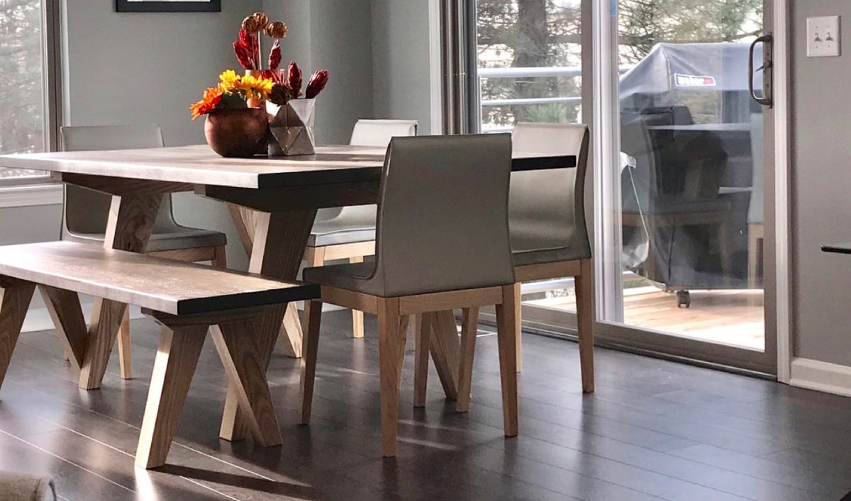 Polo Wood Chair by SohoConcept, showing polo wood dining chairs with dining table & bench in live shot.