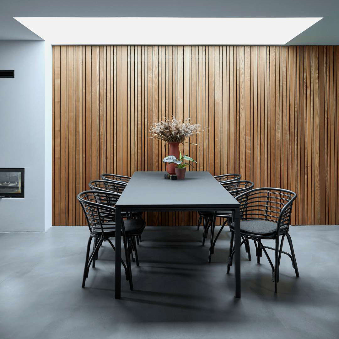 Pure Indoor Aluminum Rectangular Dining Table by Cane-Line, showing pure indoor aluminum rectangular dining table with chairs in live shot.