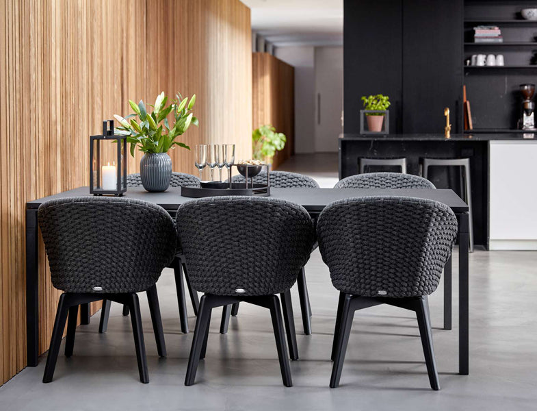 Pure Indoor Aluminum Rectangular Dining Table by Cane-Line, showing pure indoor aluminum rectangular dining table with chairs in live shot.