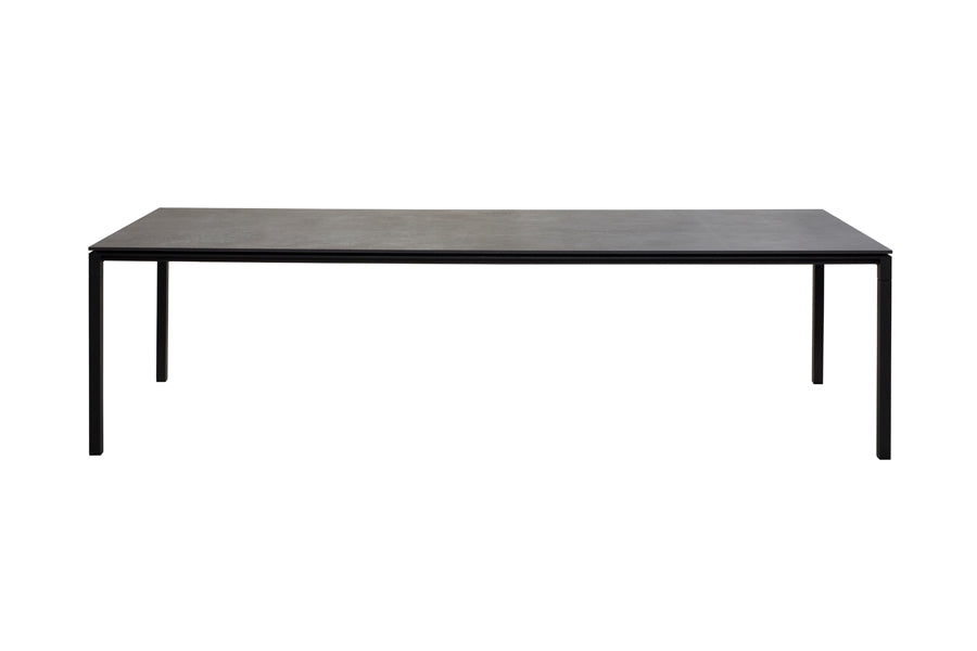 Pure Indoor Aluminum Rectangular Dining Table by Cane-Line, showing front view of pure indoor aluminum rectangular dining table in lava grey powder coated aluminum/black linoleum.