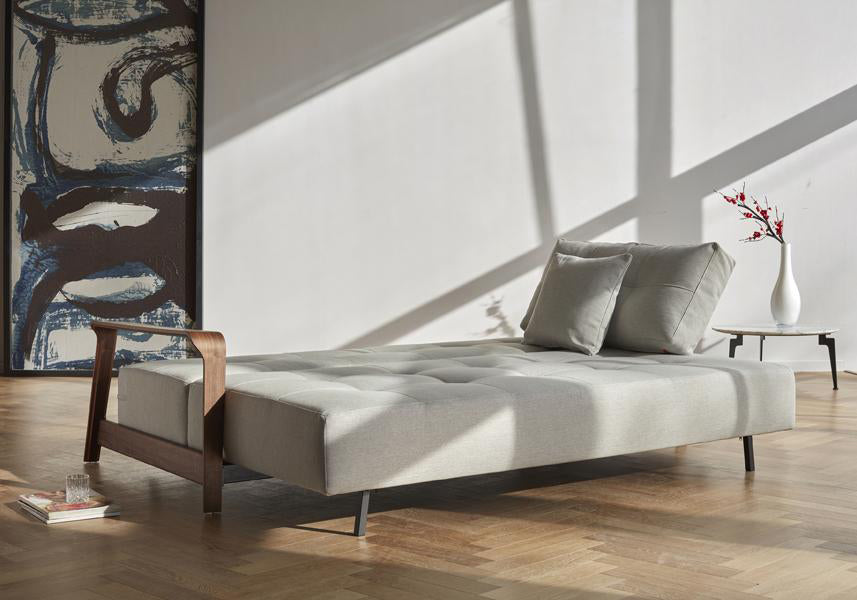 Ran D.E.L Sofa Bed by Innovation, showing ran d.e.l sofa bed as bed size with table in live shot.