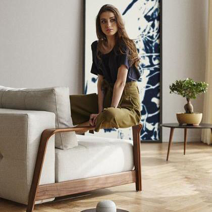 Ran D.E.L Sofa Bed by Innovation, showing ran d.e.l sofa bed with table in live shot.
