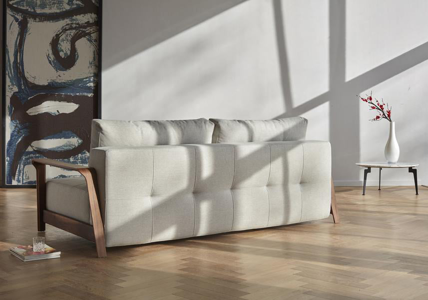 Ran D.E.L Sofa Bed by Innovation, showing ran d.e.l sofa bed with table in live shot.