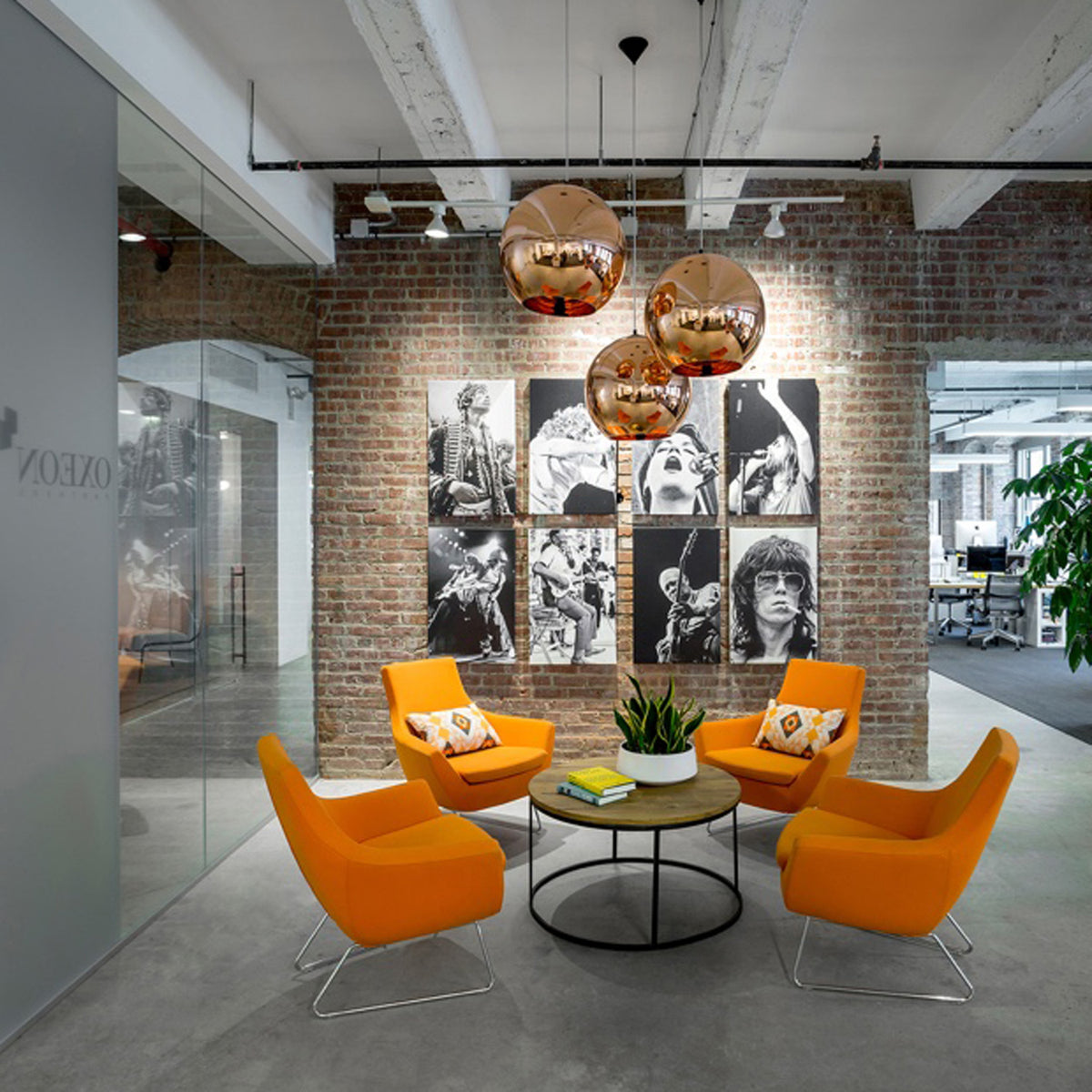 Rebecca Wire Base Arm Chair by SohoConcept, showing four wire sled arm chair with table in live shot.