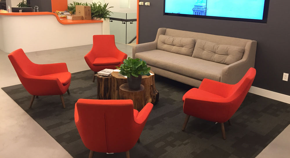 Rebecca Wood Arm Chair by SohoConcept, showing four wood arm chairs with table & sofa in live shot.