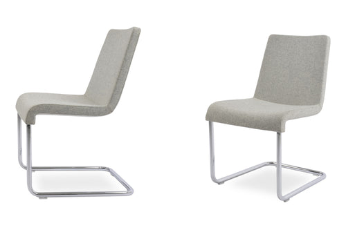 Reis Chair by sohoConcept, showing two chairs together.