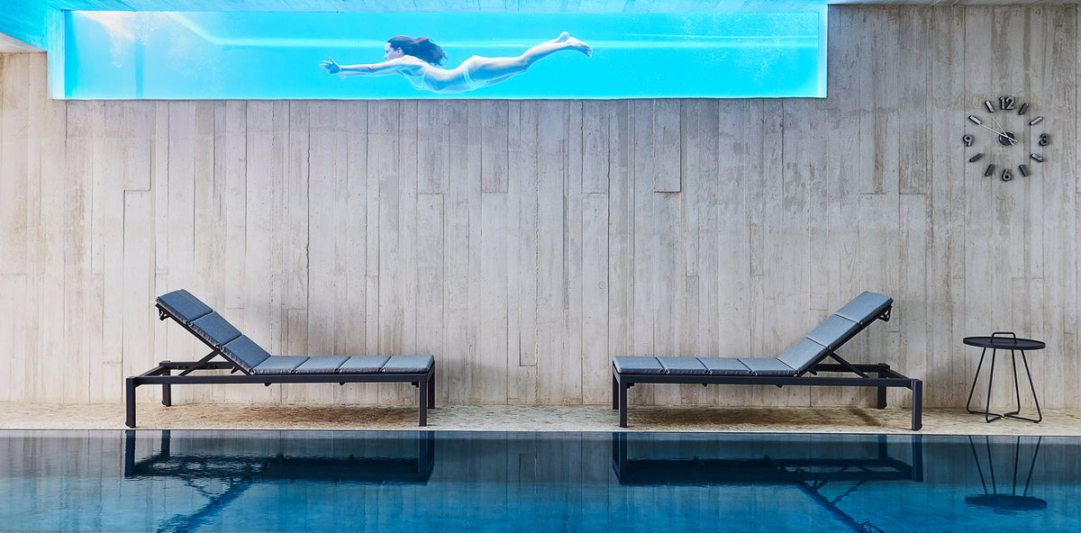 Relax Stackable Sunbed by Cane-Line, showing relax stackable sunbeds in live shot.