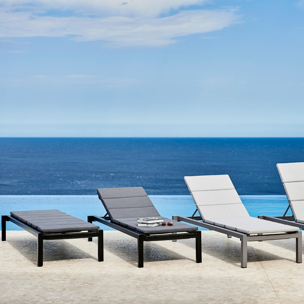 Relax Stackable Sunbed by Cane-Line, showing relax stackable sunbeds in live shot.