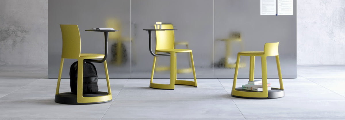 Revo Low Stool by Toou, showing revo low stool with chairs in live shot.