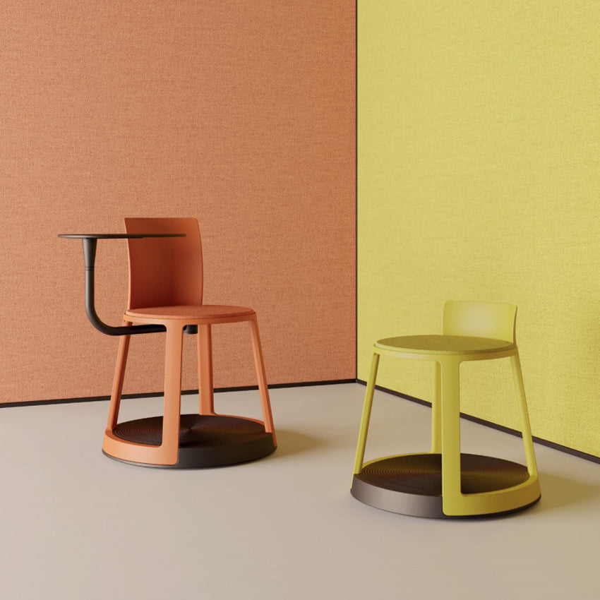 Revo Low Stool by Toou, showing revo low stool with chair in live shot.