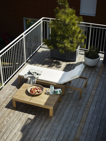 Riviera Sunlounger by Skagerak, showing riviera sunlounger with cushion in live shot.