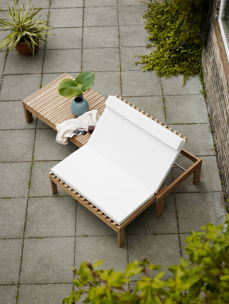 Riviera Lounge by Skagerak, showing riviera lounge with cushion in live shot.