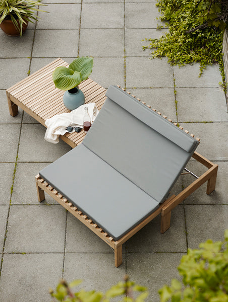 Riviera Lounge by Skagerak, showing riviera lounge with cushion in live shot.