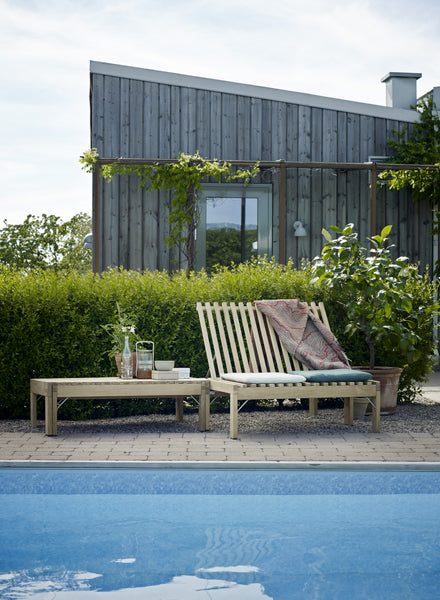 Riviera Lounge by Skagerak, showing riviera lounge with cushion in live shot.