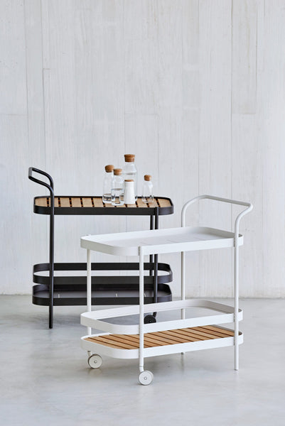 Roll Bar Trolley by Cane-Line, showing roll bar trolleys in live shot.