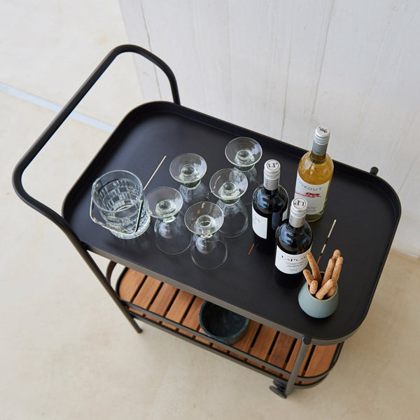 Roll Bar Trolley by Cane-Line, showing roll bar trolley in live shot.